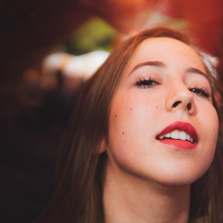 Mira Chen, Lead Design Curator at Motive Garden Clear, reviewing corporate floral arrangements